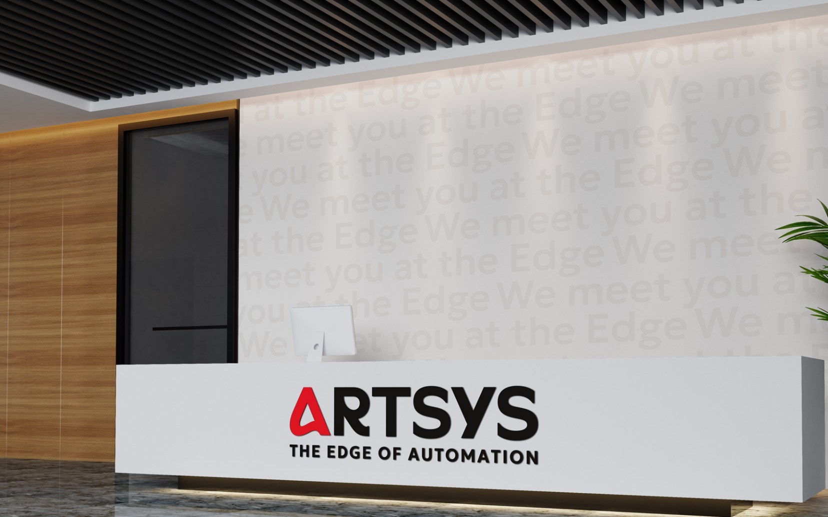 The Artsys logo with the line “The Edge of Automation” on a white reception desk